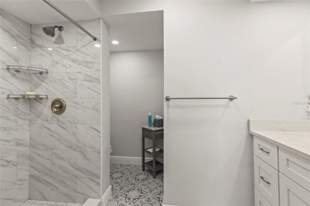 19029 US Highway 19 N Unit 7-9, Clearwater, FL 33764 - bathroom featuring toilet, tiled shower, vanity, and baseboards