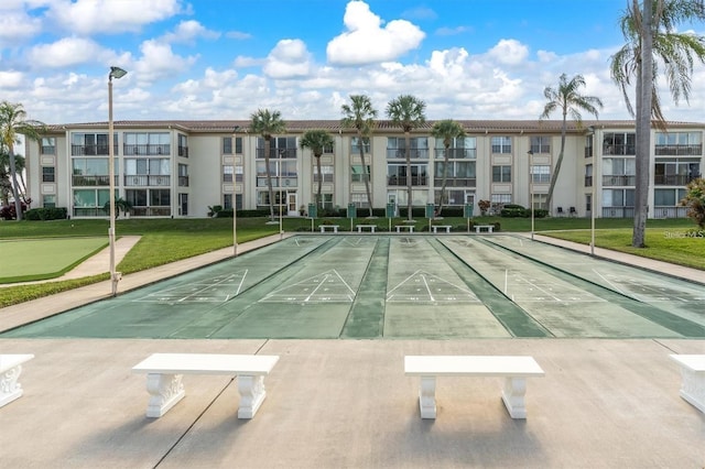 19029 US Highway 19 N Unit 7-9, Clearwater, FL 33764 - view of property's community featuring uncovered parking, a yard, and shuffleboard