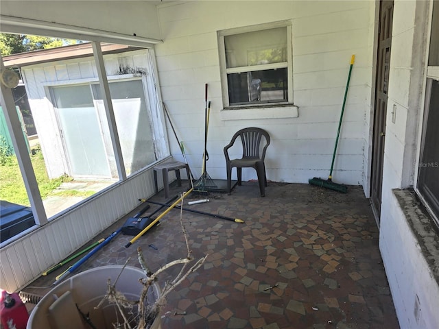 unfurnished sunroom featuring a healthy amount of sunlight