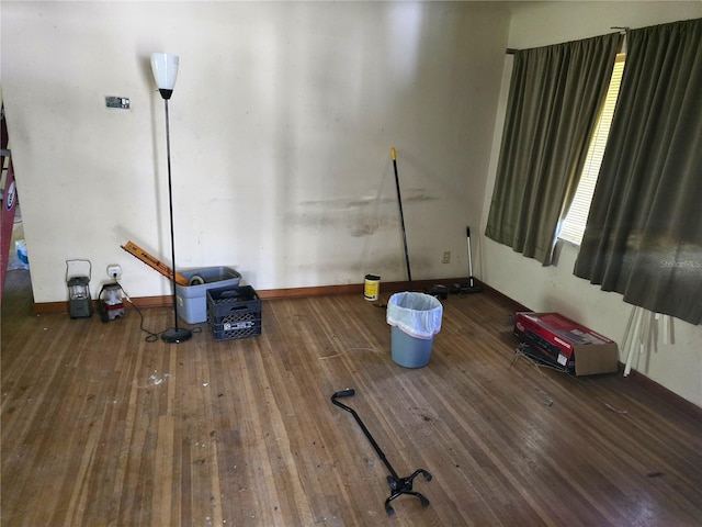 interior space with hardwood / wood-style flooring and baseboards