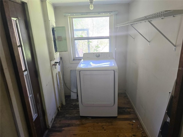 washroom featuring dark wood-style floors, laundry area, washer / dryer, and baseboards