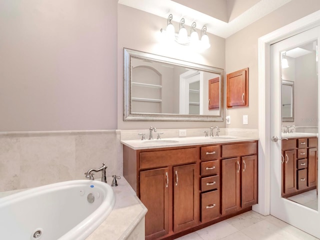 full bath with a sink, a tub with jets, and double vanity