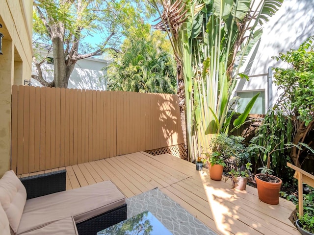 wooden deck featuring fence