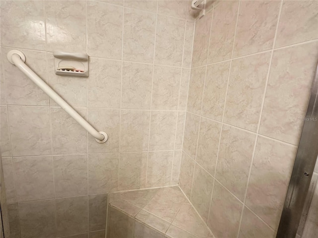 full bath featuring a tile shower