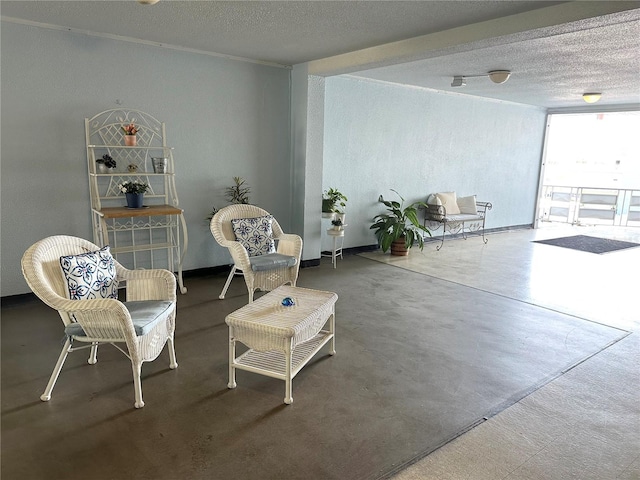 sitting room featuring a textured ceiling