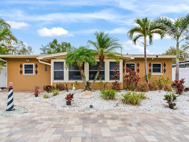 single story home with stucco siding