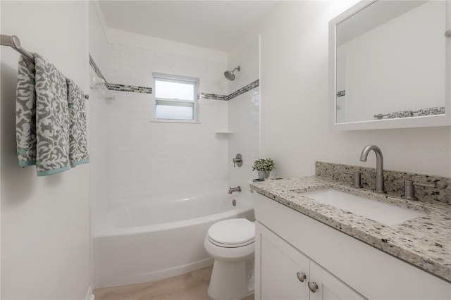 full bathroom featuring shower / washtub combination, vanity, and toilet