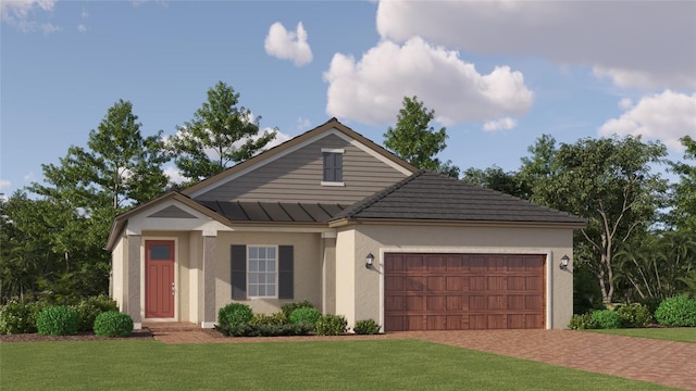 ranch-style house featuring decorative driveway, stucco siding, an attached garage, a front yard, and a standing seam roof