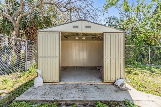 view of shed with a fenced backyard