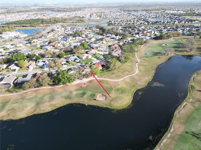 bird's eye view with a residential view and a water view