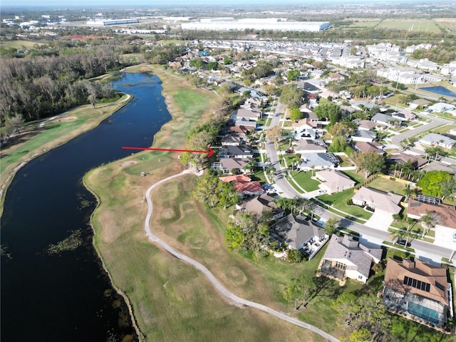 birds eye view of property with a water view and a residential view