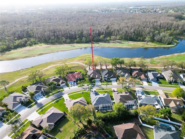 bird's eye view with a residential view, a water view, and a forest view