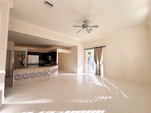 unfurnished living room with light tile patterned floors, baseboards, visible vents, ceiling fan, and ornamental molding