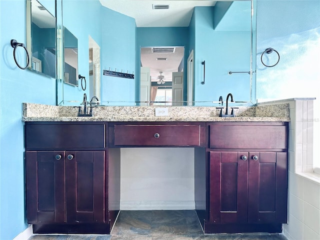 full bathroom featuring double vanity, a sink, and visible vents