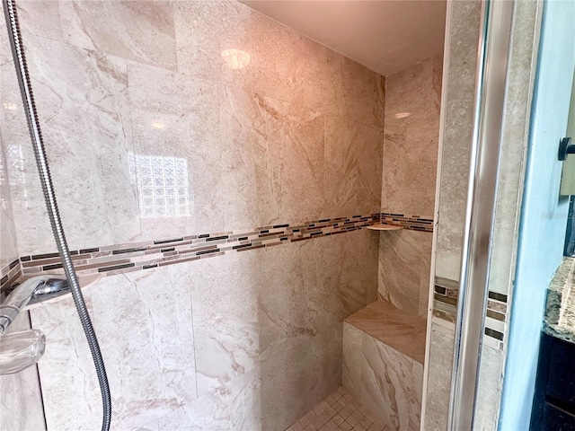 full bathroom with a tile shower