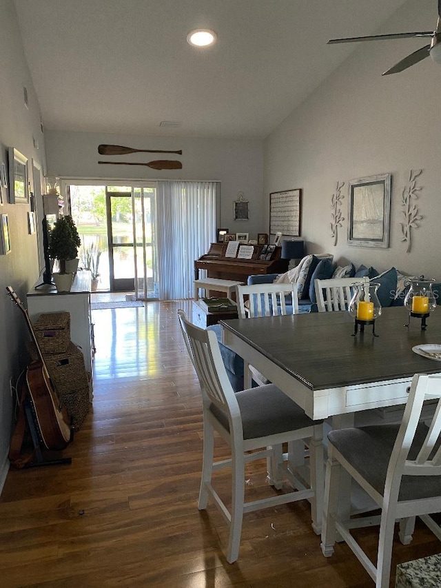 dining space featuring lofted ceiling, ceiling fan, wood finished floors, and recessed lighting