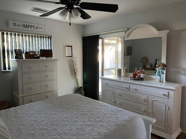 bedroom featuring visible vents and ceiling fan