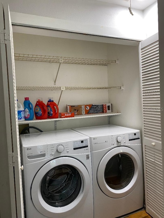 laundry room with laundry area and washer and clothes dryer