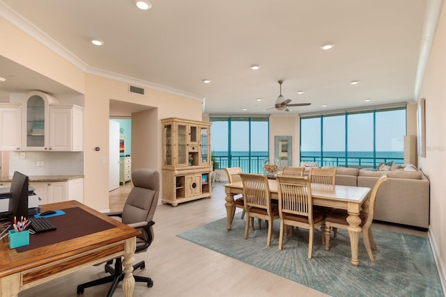 dining room featuring recessed lighting, visible vents, crown molding, and light wood-style flooring