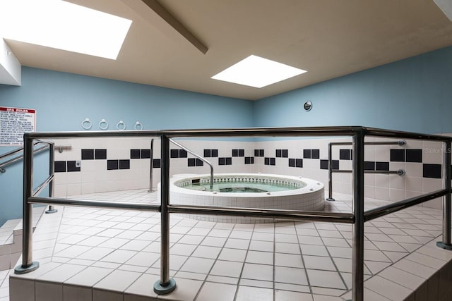 interior space featuring an indoor in ground hot tub