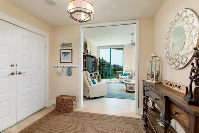 foyer entrance featuring light tile patterned flooring