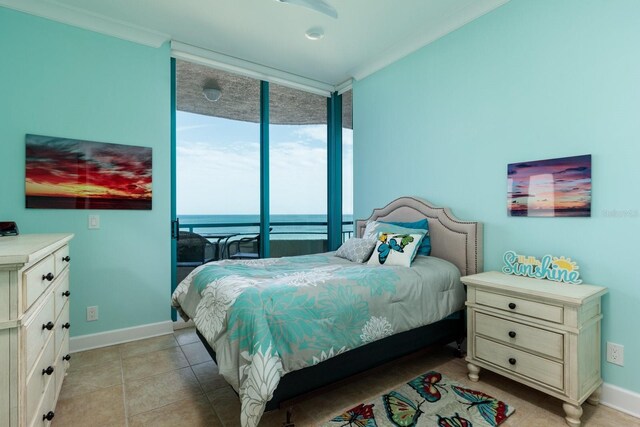 bedroom featuring crown molding, light tile patterned flooring, and baseboards