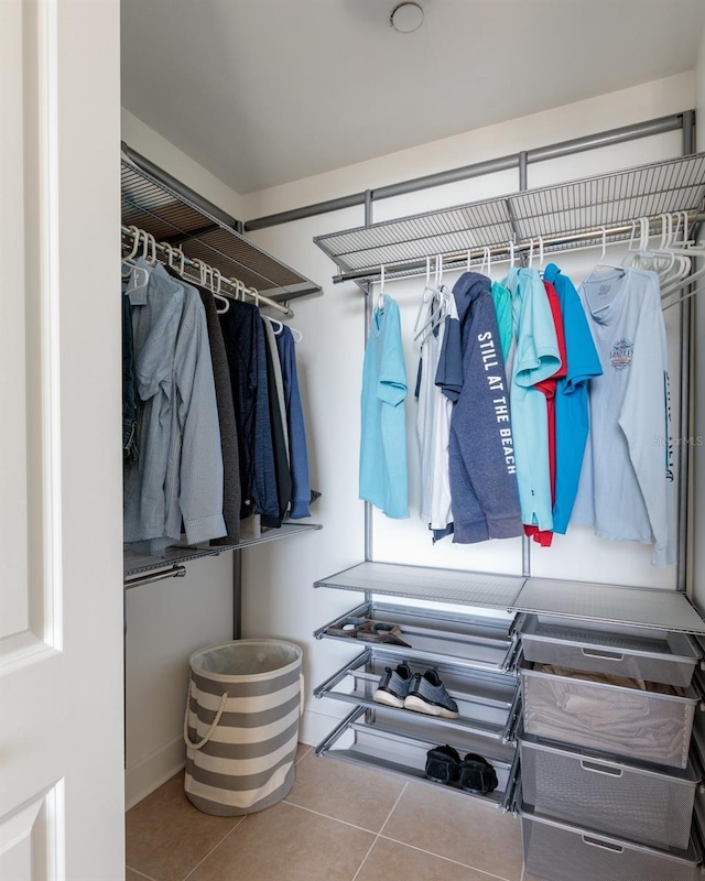 walk in closet featuring tile patterned flooring