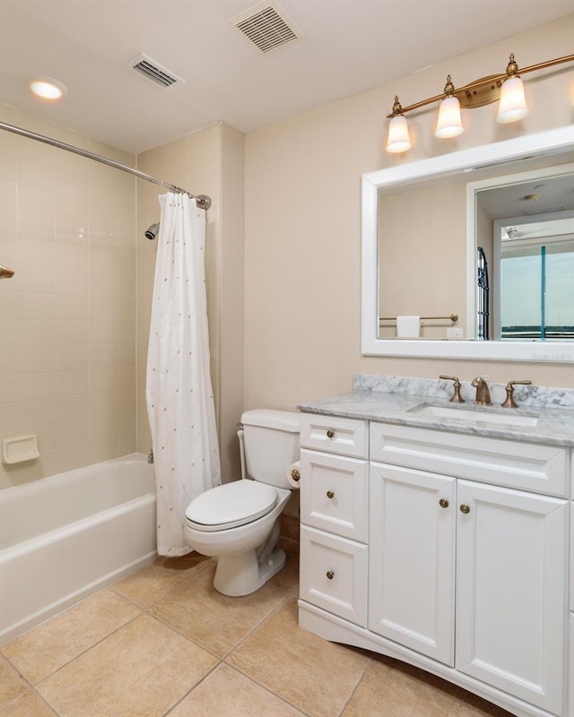 bathroom featuring toilet, vanity, tile patterned flooring, and visible vents