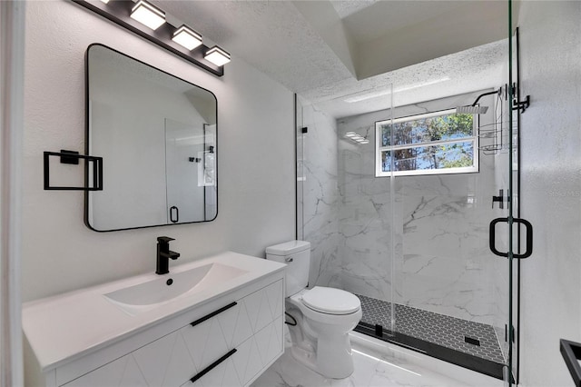 bathroom with a textured ceiling, toilet, vanity, marble finish floor, and a marble finish shower