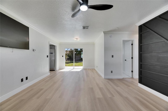 unfurnished living room featuring a textured ceiling, light wood-type flooring, visible vents, and crown molding