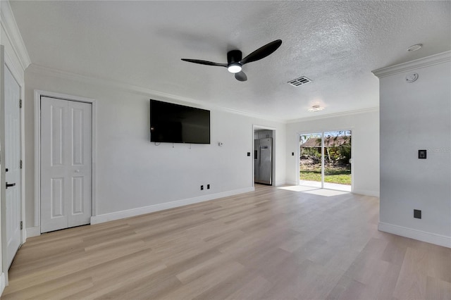 unfurnished living room with a textured ceiling, ornamental molding, visible vents, and light wood-style floors