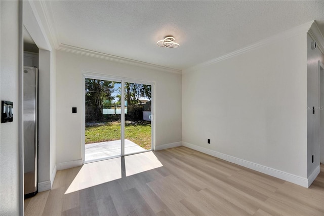 interior space featuring a textured ceiling, baseboards, light wood-style flooring, and crown molding