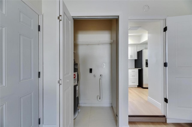 washroom featuring laundry area, baseboards, and washer hookup