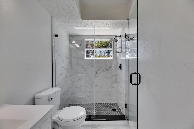 bathroom featuring toilet, marble finish floor, a marble finish shower, and a textured wall