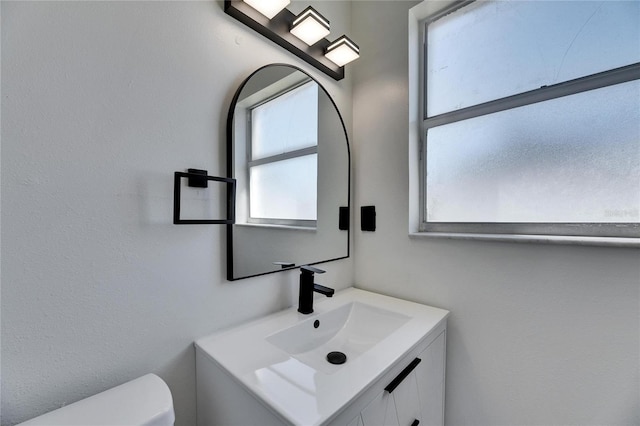 half bath with toilet and vanity