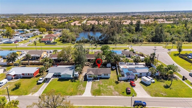 drone / aerial view with a residential view and a water view