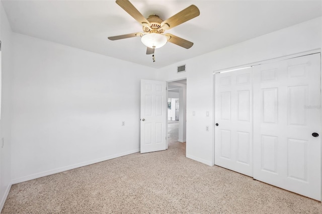 unfurnished bedroom with a closet, visible vents, ceiling fan, and baseboards