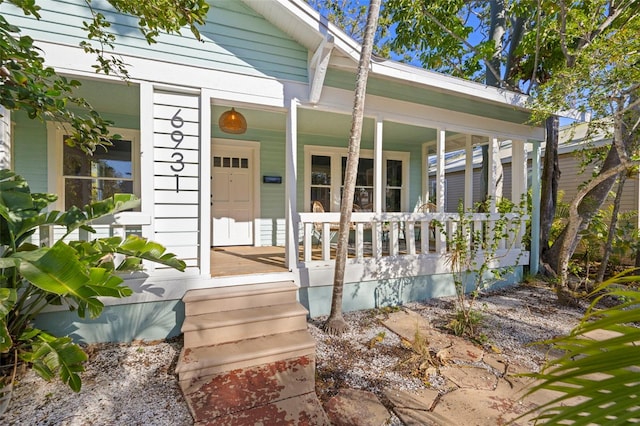 property entrance featuring covered porch