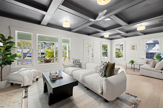 living room with hardwood / wood-style floors, beamed ceiling, coffered ceiling, and visible vents