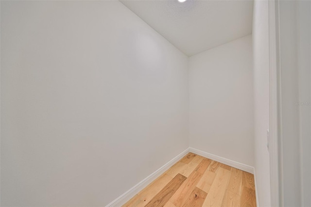 room details featuring baseboards and wood finished floors