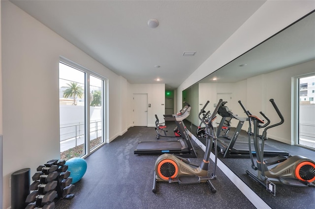 gym with plenty of natural light and baseboards