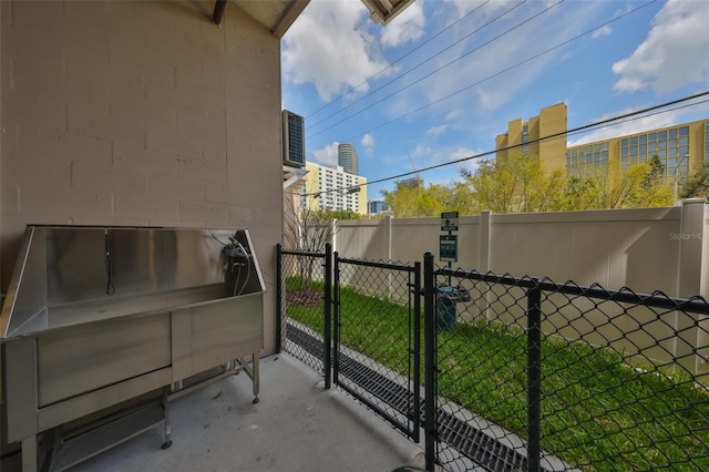 exterior space with a lawn and fence