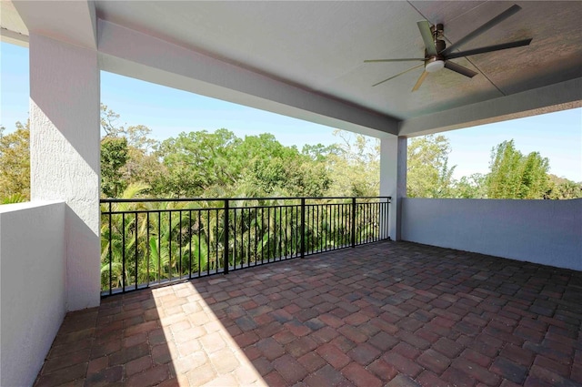 view of patio / terrace featuring a balcony and a ceiling fan