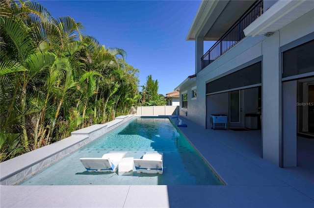 view of pool featuring a fenced in pool and fence