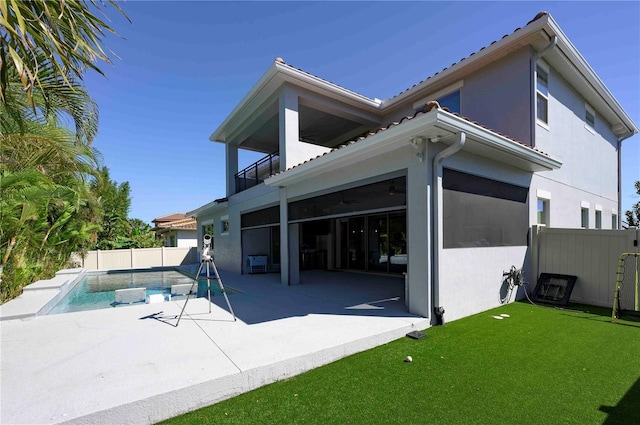 back of property with a patio, a fenced backyard, a balcony, and stucco siding