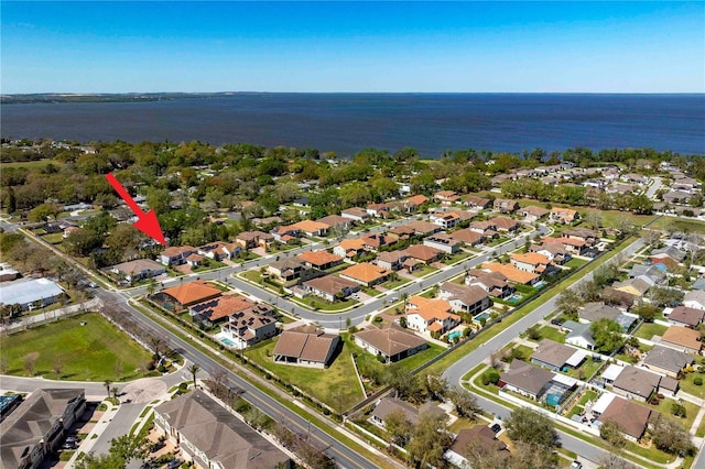 bird's eye view with a water view and a residential view