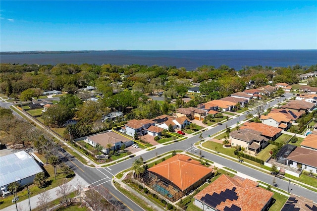 birds eye view of property featuring a water view and a residential view