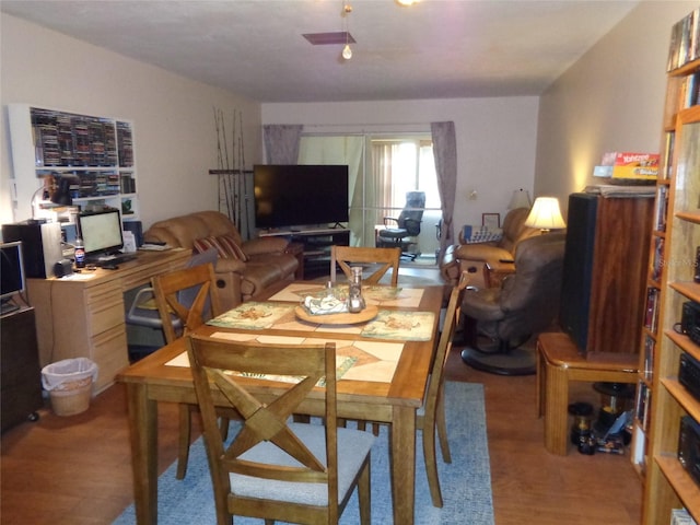 dining space featuring wood finished floors