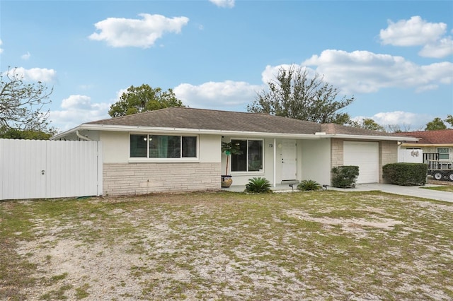 single story home featuring a garage, concrete driveway, stone siding, fence, and stucco siding