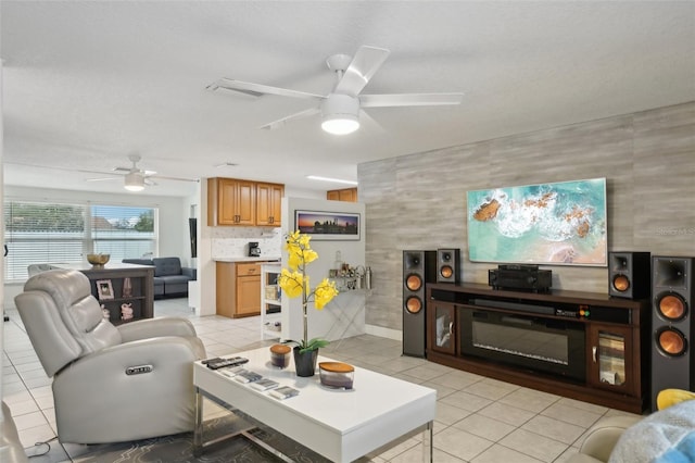 7740 Bracken Dr, Port Richey, FL 34668 - living room with ceiling fan and light tile patterned flooring